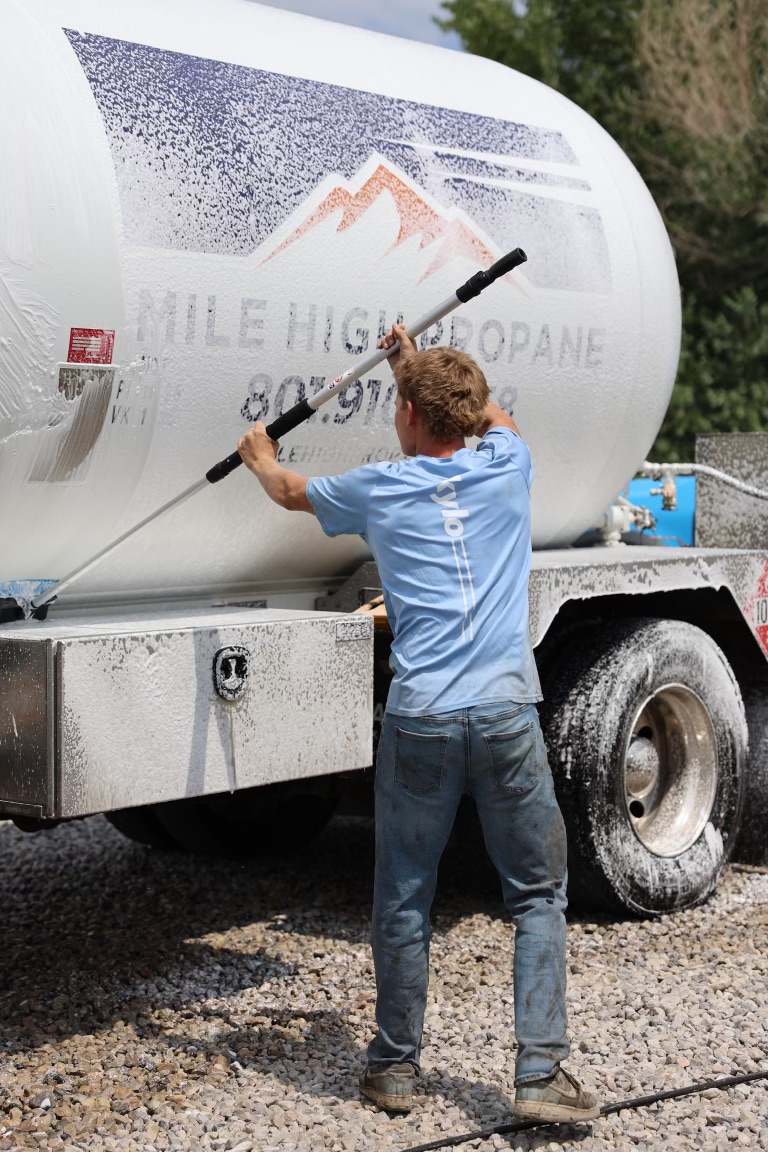 Skylo technician washing a commercial propane truck